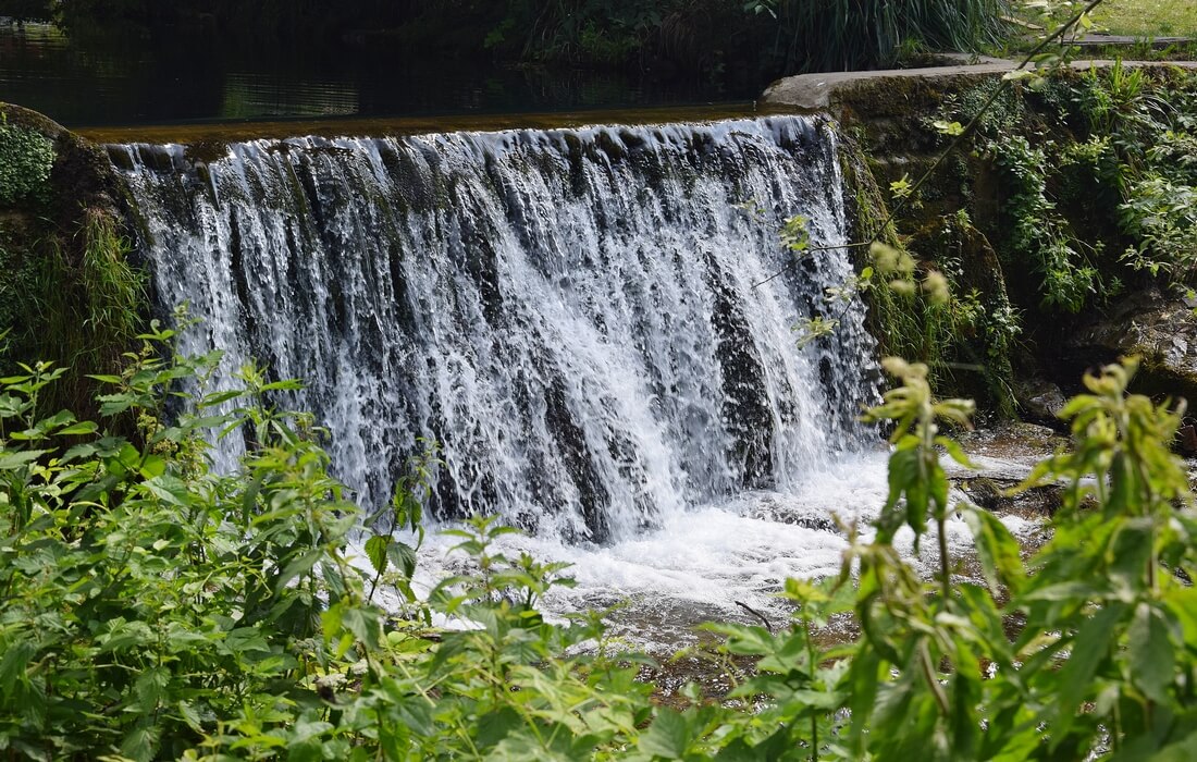 Small waterfall in front of mountain lodge Jankovac